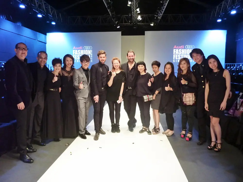 Global guest ambassador Scott Sloan, styling the models’ hair on the runway.