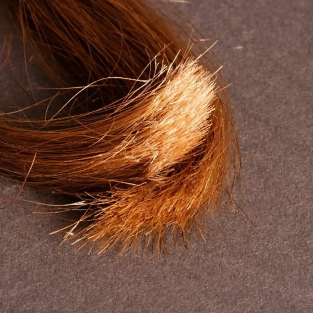 
Probléma hosszabb haj esetén: töredezett hajvégek